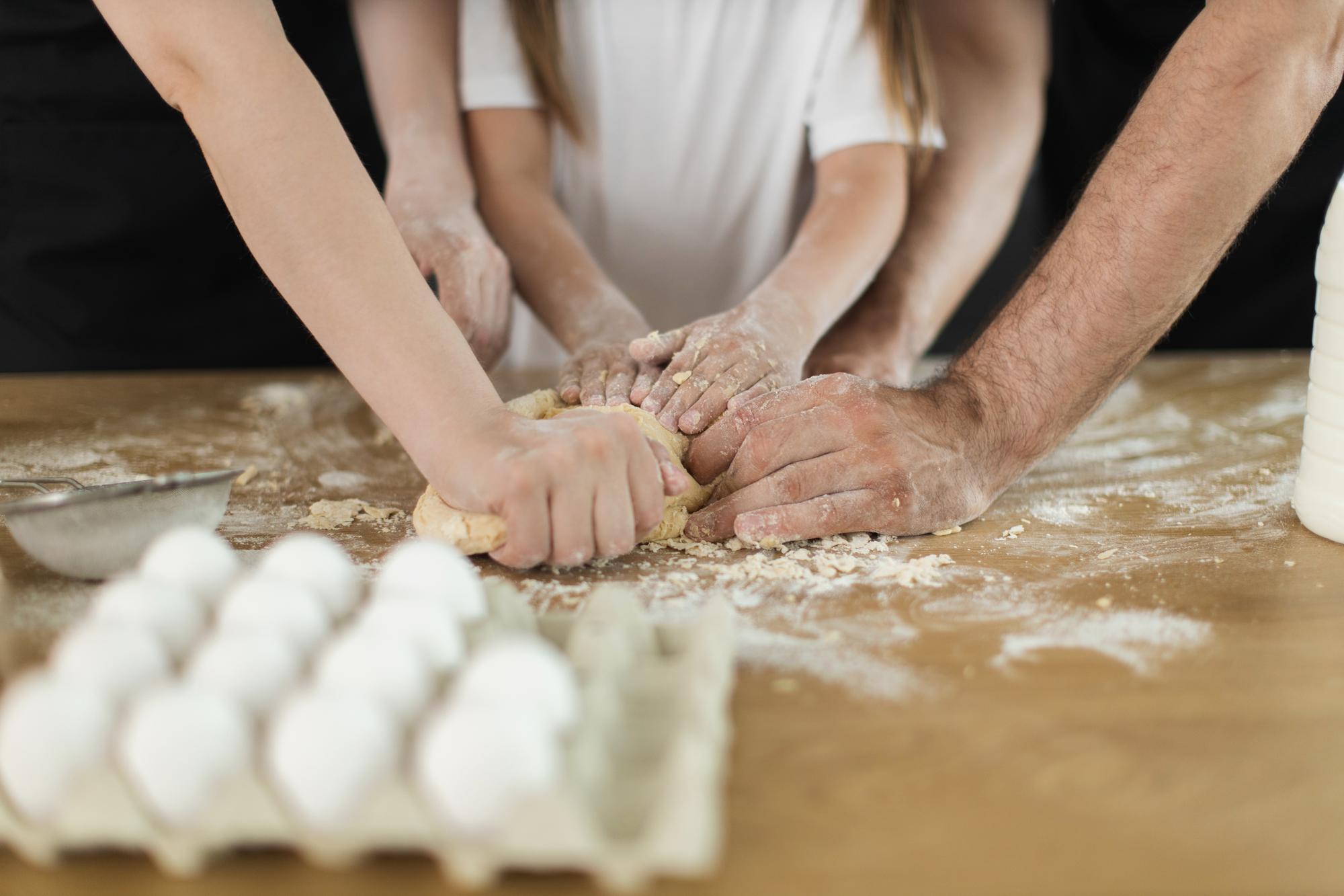 Workshop participants kneading dough